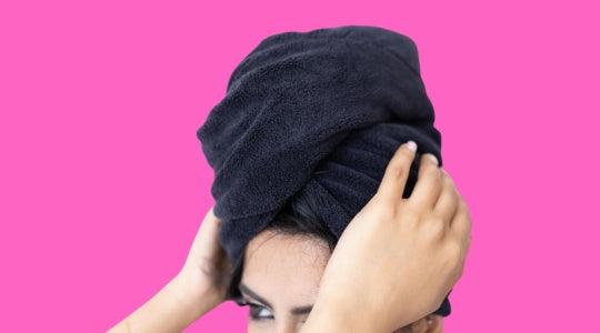 Woman using microfibre towels for her hair